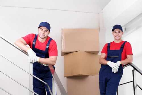 Packed moving boxes and furniture ready for removals in Wennington
