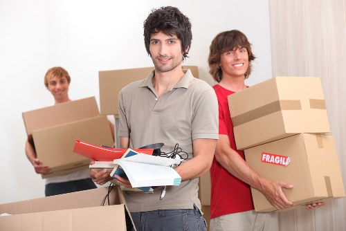 Local moving team handling access and parking on a Wennington street