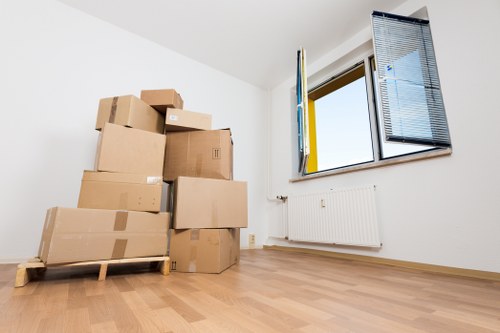 Prepared boxes and furniture ready for a removals van in Wennington
