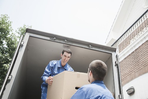 Removal van and packed belongings in a Wennington street