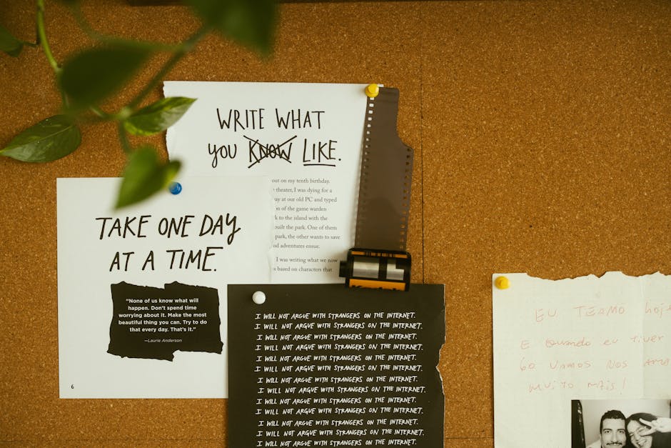 A close-up of a brown corkboard wall with various handwritten and printed notes pinned to it, including a white paper with the message 'TAKE ONE DAY AT A TIME' and a quote about worry. Above these pap